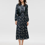 Çevre Dostu Kürk Yelek ve Çiçek Desenli Elbise İkili Takım